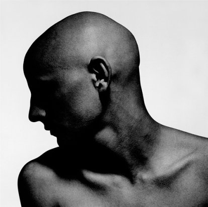 Bald male in profile black white portrait photographed by photog